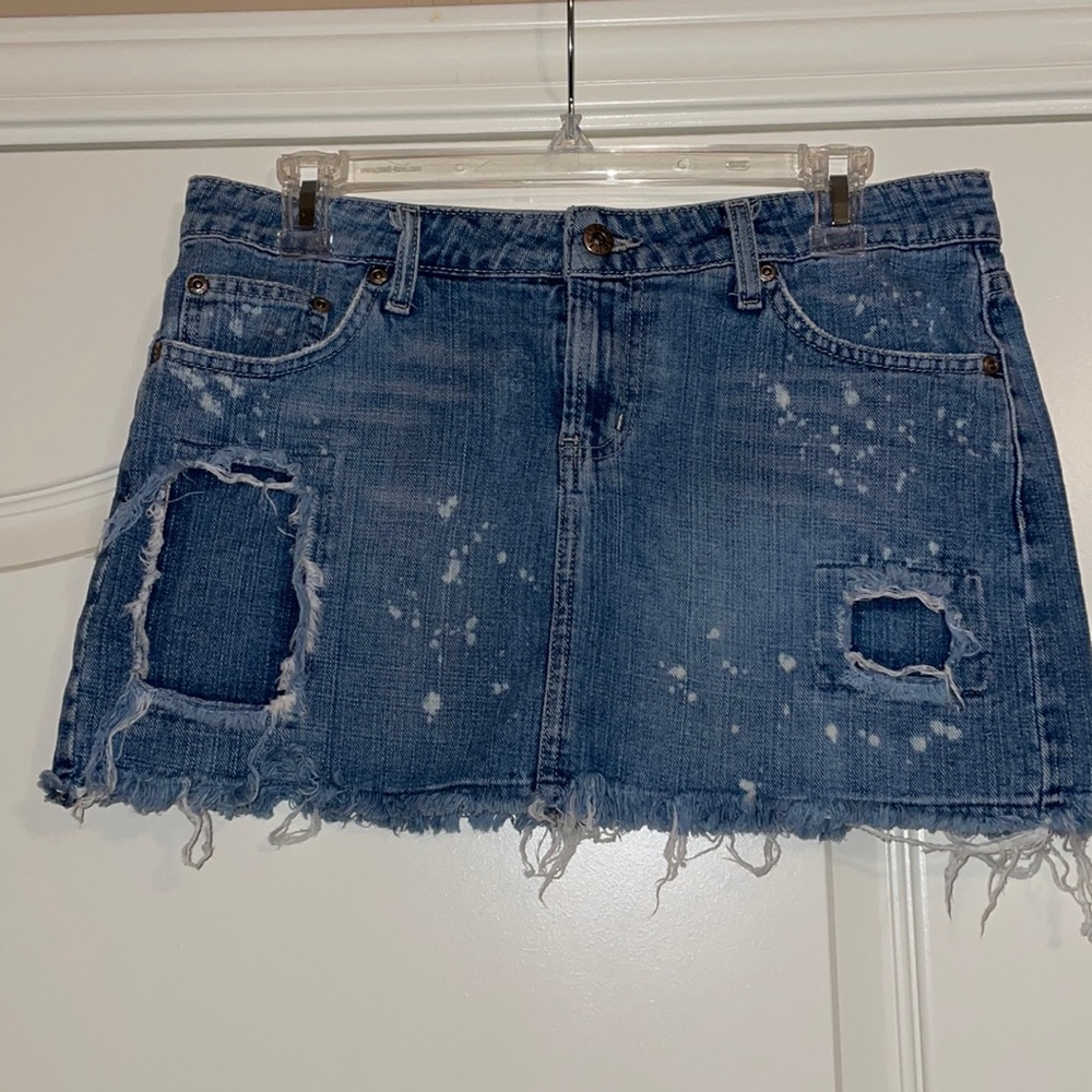 Distressed denim mini skirt